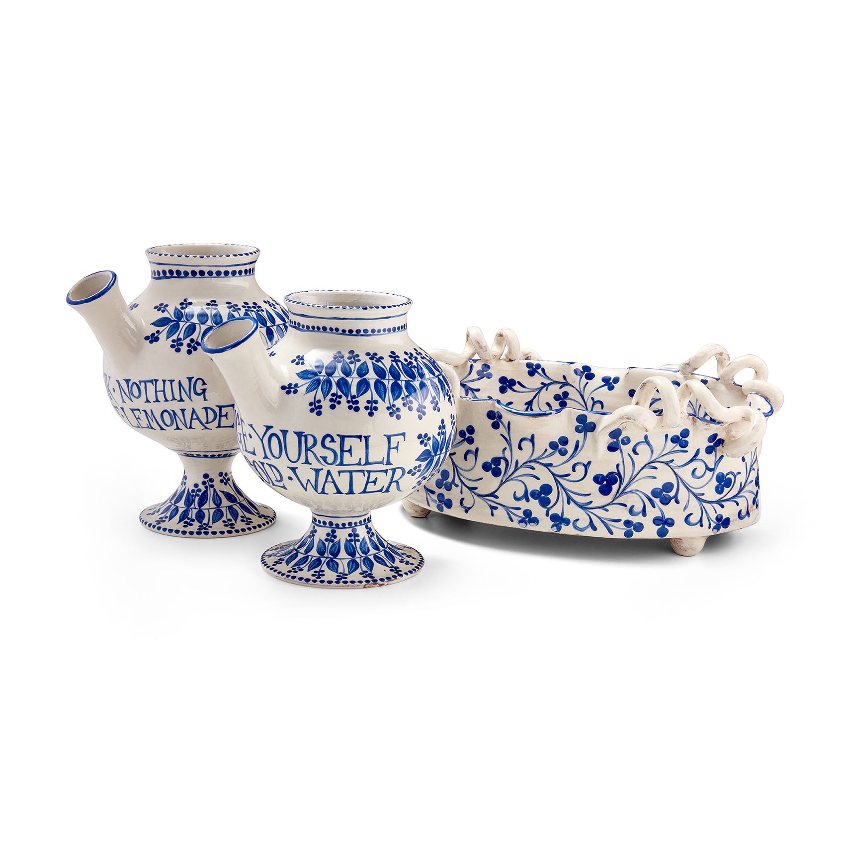 Exclusively at Shop Kit Kemp, three white and Dutch blue painted artwork vessels, with historical inspired themes, created by Katrin Moye