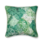 This Kit Kemp Design Studio cushion features the Harlequin pattern, a highly textured printed fabric (typically a linen or linen-blend base) created for Christopher Farr Cloth. The design is a playful take on the diamond/harlequin motif, using a rich palette of deep and lighter greens to seamlessly blend floral and geometric patterns, resulting in a complex, layered print with soft watercolour depth that evokes a playful patchwork.
