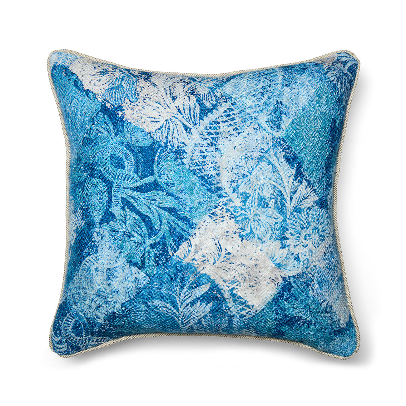 Statement cushion in Kit Kemp's Harlequin River Bank printed linen-blend fabric. The pattern is a layered blue and white patchwork of florals and geometric scrolls with a soft, watery texture.