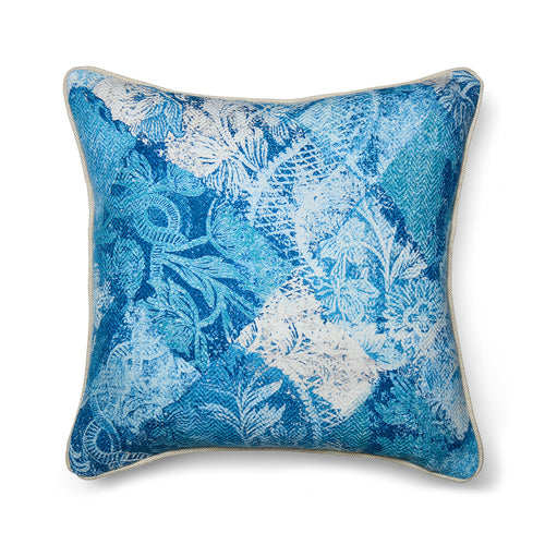 Statement cushion in Kit Kemp's Harlequin River Bank printed linen-blend fabric. The pattern is a layered blue and white patchwork of florals and geometric scrolls with a soft, watery texture.