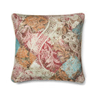 Rectangular cushion featuring Kit Kemp's Harlequin printed fabric for Christopher Farr Cloth. The linen-blend textile displays a bold argyle diamond grid in mottled blue, terracotta orange, and red with a soft, hand-painted watercolour effect.