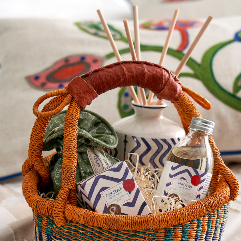 Signature Kit Kemp fragrance collection of Lavender and Eucalyptus presented in woven African basket, with candle, room diffuser scent, hand cream and lavender bag. 