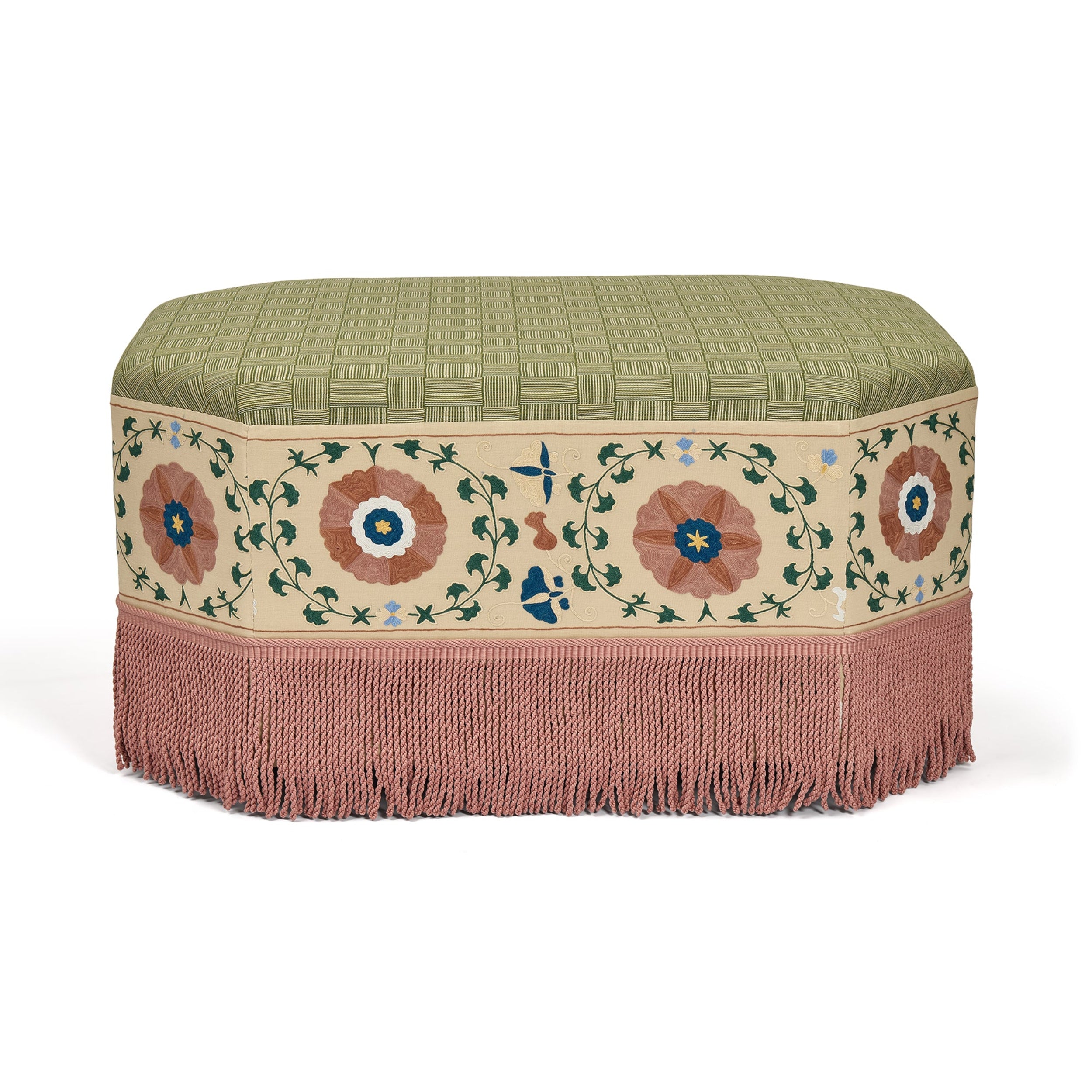 Decorative ottoman with floral patterns and fringes on a white background