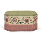 Decorative ottoman with floral patterns and fringes on a white background