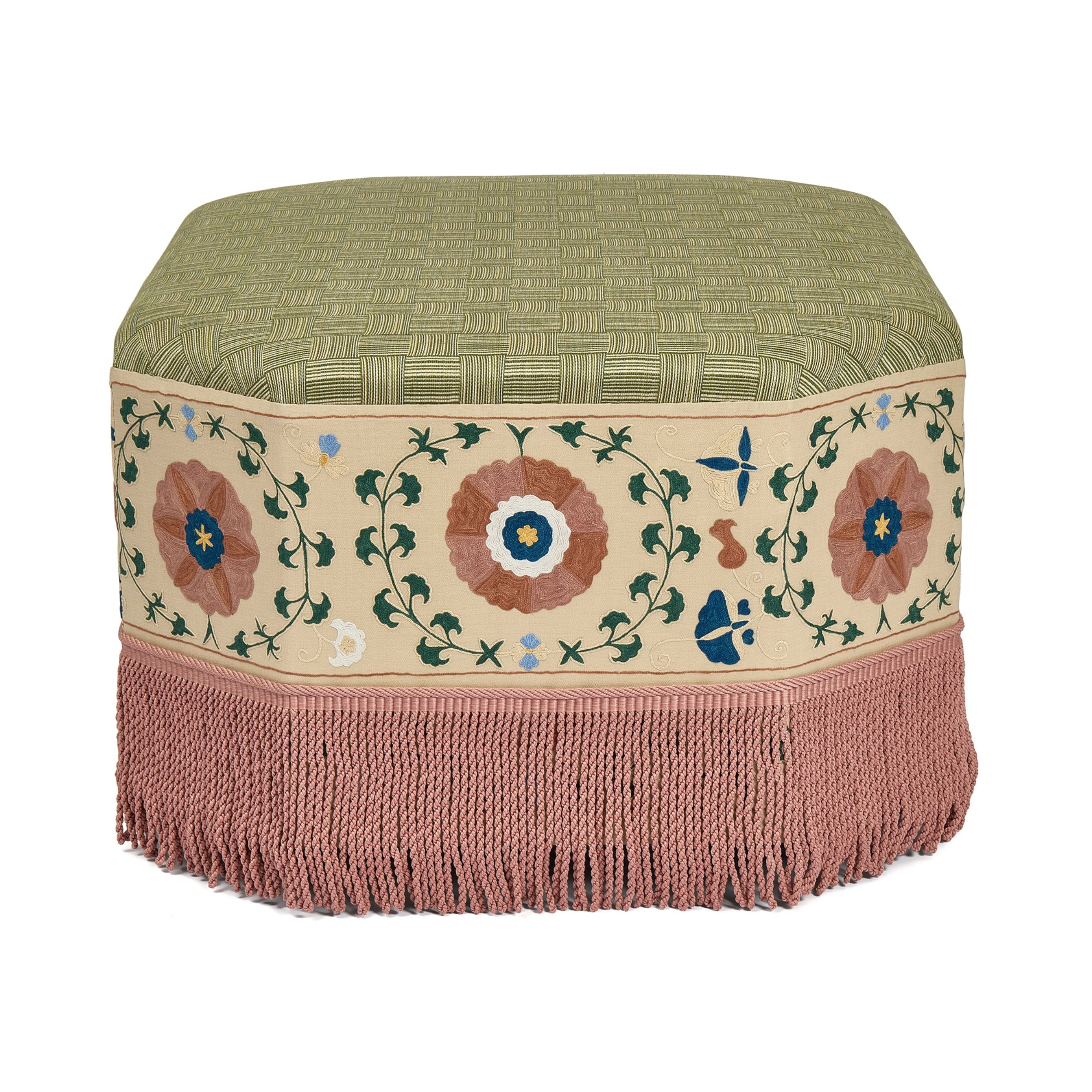 Decorative ottoman with floral embroidery and fringed edge on a white background