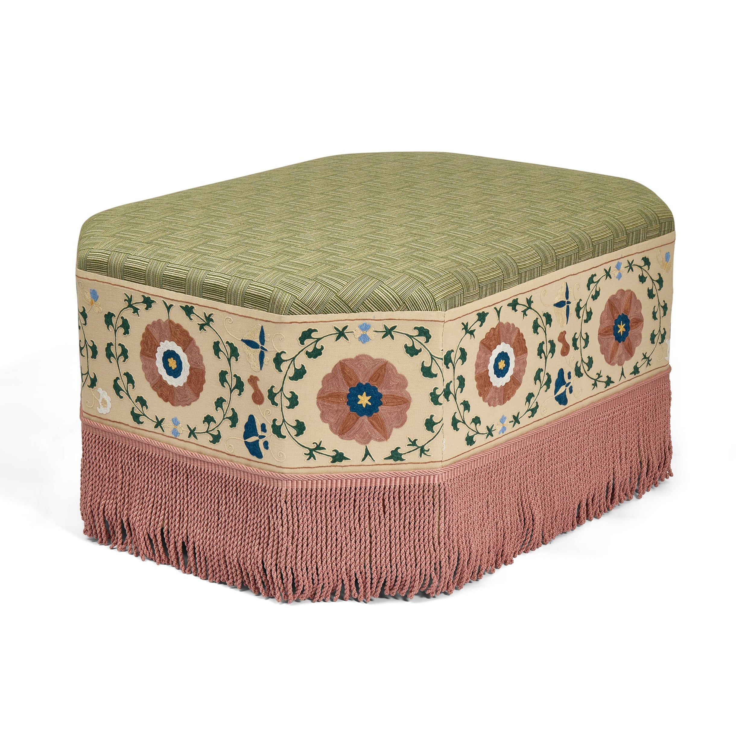 Decorative ottoman with floral patterns and fringes on a white background