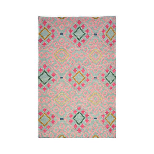 Kit Kemp and Annie Selke rug in pops of pink, green and warm yellow tones, made to resemble a one-of-a-kind vintage document.