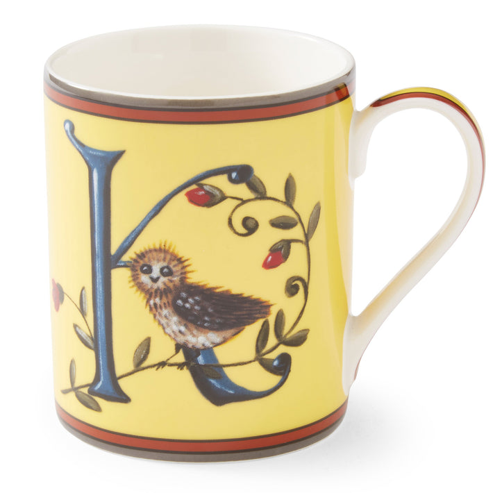 The blue K on this lemon yellow mug forms an ideal perch for our small owl to survey the outlook for the day to come, amongst entwined rose hip.