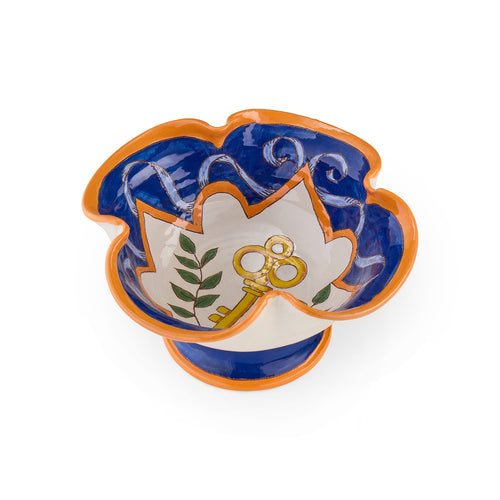 Decorative ceramic bowl with floral design and key symbol emoji, piece by Katrin Moye