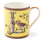 The grey L on this lemon yellow mug forms an ideal perch for our small owl to survey the outlook for the day to come, amongst entwined rose hip.