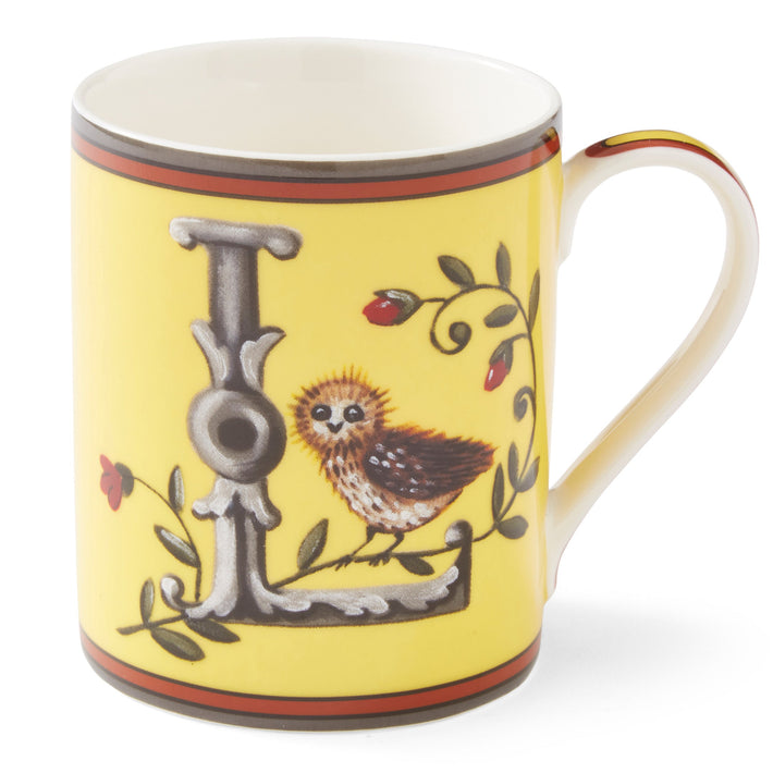 The grey L on this lemon yellow mug forms an ideal perch for our small owl to survey the outlook for the day to come, amongst entwined rose hip.