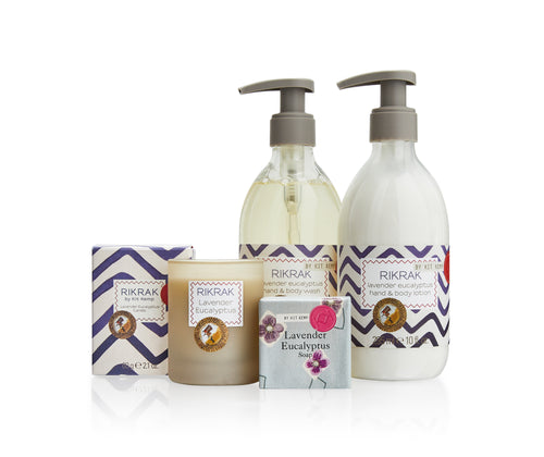 The Lavender Hand Wash Gift Set contains a 295ml hand wash, lotion, a 50g soap, & 60g candle. Packed in a olive green gift box, decorated with yellow simple smiling flowers, with a red roofed bird box printed on the lid.
