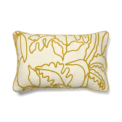 Decorative pillow with gold floral pattern on a white background
