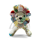 A front view of Lennart the Lion, a handmade soft toy from the Kit Kemp Patchwork Collection. This one-of-a-kind design features a face crafted from vibrant, striped upcycled fabric offcuts and a mane composed of individual fabric petals.