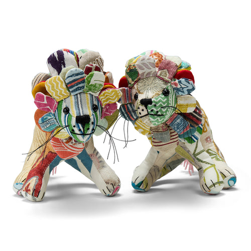Two Lennart the Lion standing on all fours, demonstrating the structural detail of the handmade design. Each piece is filled with recyclable materials, making it a thoughtful, planet-friendly collector's item.
