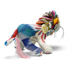 A three-quarter view of Lennart the Lion, displaying the eclectic mix of Busy Lizzie blue, green, and cream patterned fabrics. This sustainable design breathes new life into Design Studio offcuts through meticulous UK-based hand-stitching.