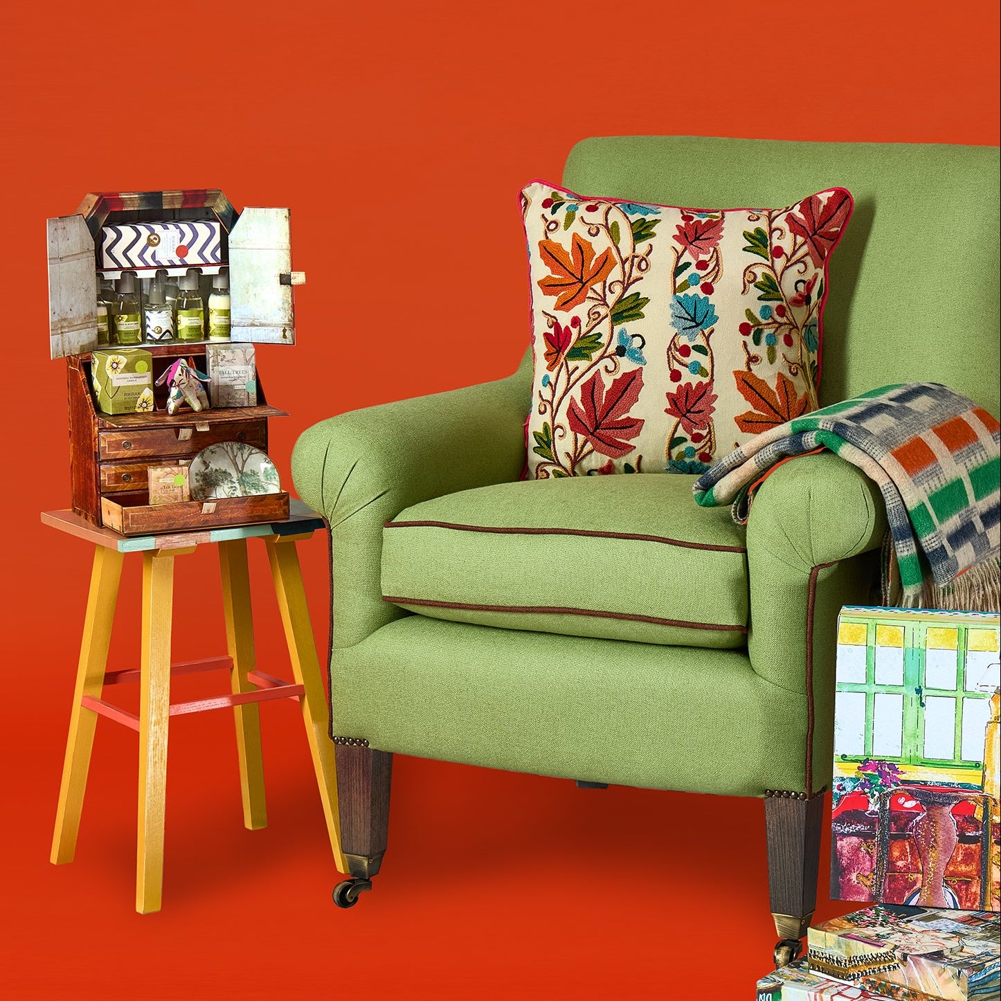 Fronsac upholstered cushion by Kit Kemp paired with Brick Weave throw, Pixie side table and Mini RikRak Bureau, perfectly paired with iconic Leo chair Exclusively at Shop Kit Kemp.