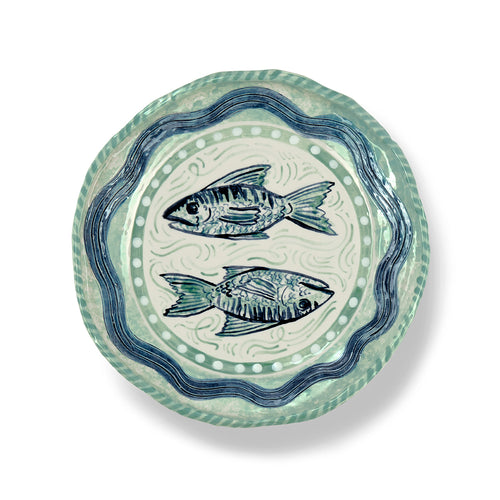 Sasha Compton handmade plate with two mackerel in centre surrounded by blue and green water, artist exclusive for Shop Kit Kemp