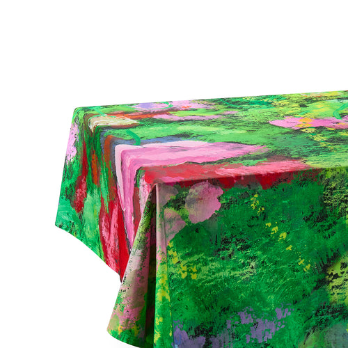 A close-up of the Meadow tablecloth corner, showcasing the vibrant, hand-painted floral textures and the specialist water-repellent finish on high-quality Indian cotton. Exclusively at Shop Kit Kemp.