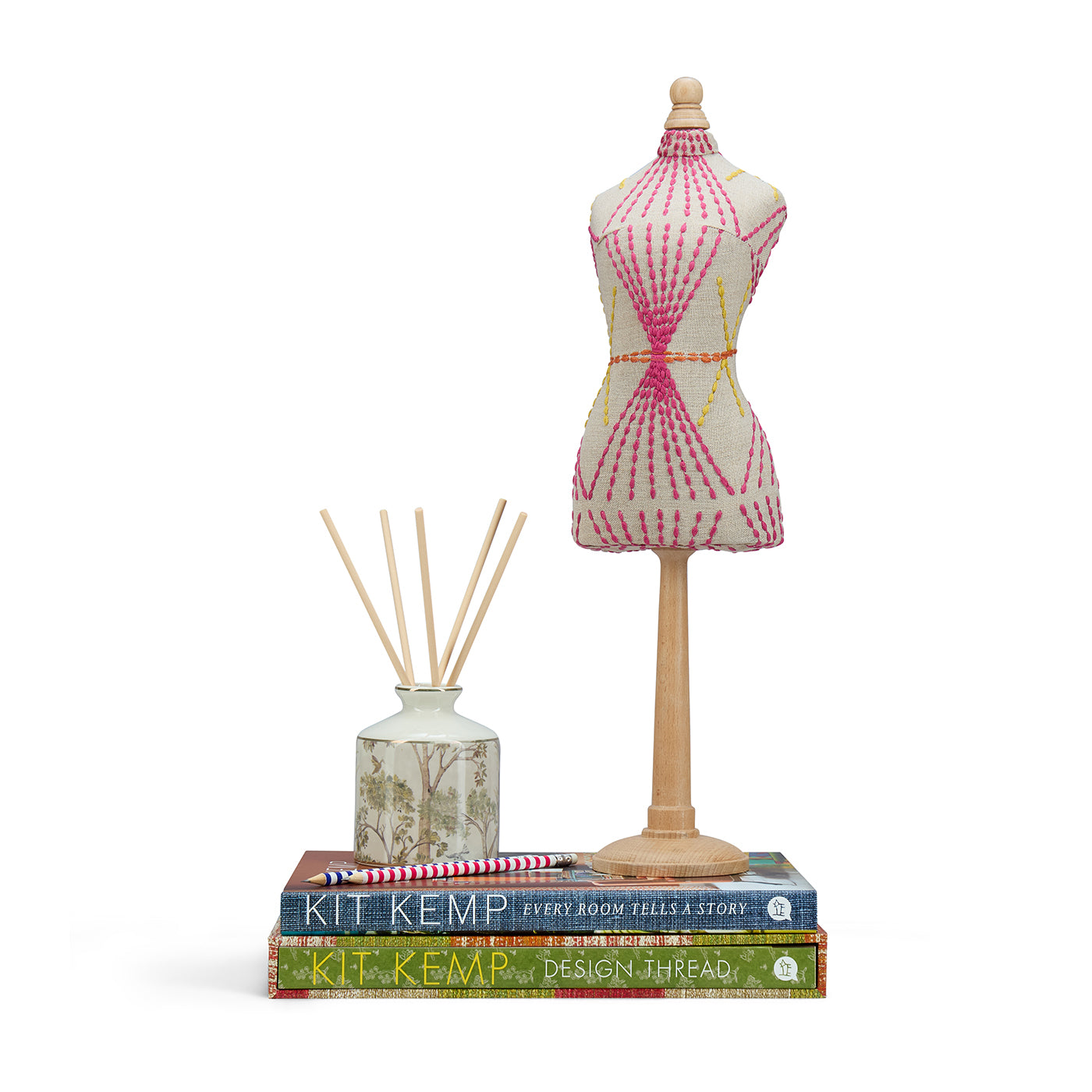 Decorative mini mannequin embroidered in the famous Kit Kemp Mikado fabric, featuring graphic pink and yellow stitching on a natural ground. A distinctive piece of artistry, made in England.