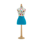 Decorative mini mannequin featuring the famous Kit Kemp Potato Print fabric. The colourful, playful graphic pattern and solid blue skirt showcase the designer's whimsical and bold aesthetic.