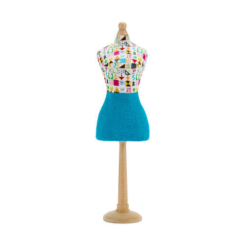 Decorative mini mannequin featuring the famous Kit Kemp Potato Print fabric. The colourful, playful graphic pattern and solid blue skirt showcase the designer's whimsical and bold aesthetic.