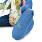 Luxury Minnie Rabbits in a vibrant patchwork of blue linen and the iconic Knight’s Tale fabric designed by Kit Kemp. Close up on its paw shows the limited edition numbers, highly sought by collectors.