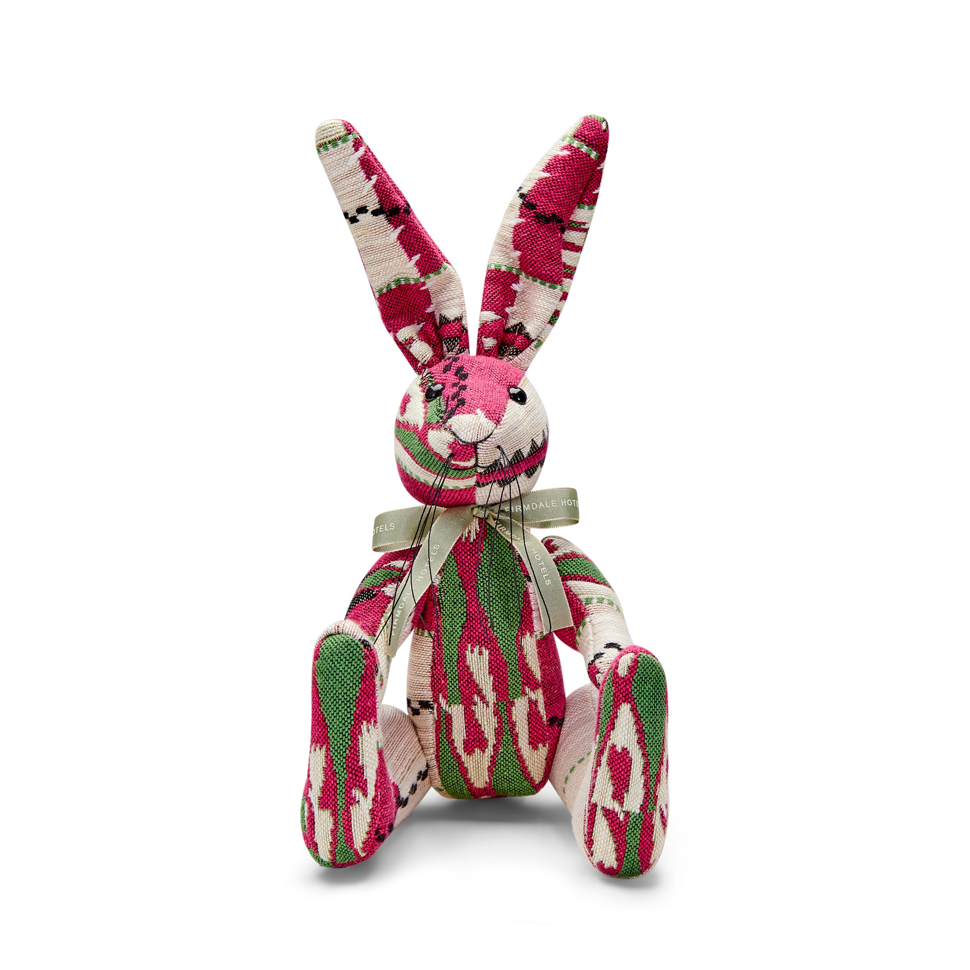 Bespoke patchwork Minnie Rabbits, meticulously handcrafted in the UK using repurposed luxury textile offcuts from the Kit Kemp Design Studio. These one-of-a-kind characters highlight superior craftsmanship through their intricate stitching, thread whiskers, and varied textures like woven wool and fine linen.