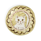 A hand-painted decorative ceramic plate by Sasha Compton titled "My Buttercup Kitten," featuring a central illustration of a seated tabby cat in soft yellow tones, encircled by a pink-dotted border and wide, expressive brushstrokes in deep clay-brown.