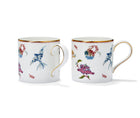 A set of two fine bone china mugs with hand-painted designs in a Mythical Creatures motif and gold accents.