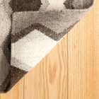 The Safety Net Flatwoven Wool Rug was inspired by the hand-knotted fishing nets that hang over the boats in Barbados. Handmade in India, design by Kit Kemp.