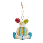 Nibbles The Mouse Patchwork Ornament by Kit Kemp for Spode. This fine china ornament boasts a whimsical, colourful design of stripes and polka dots, with bright blue feet and a flower detail on back of head. A must-have collectible that brings playful, high-end design to your festive decorations.