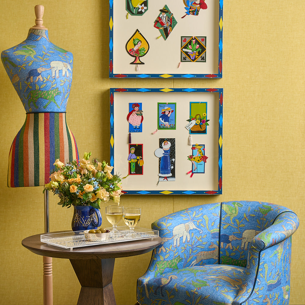 Shop The Look furniture and mannequin, Craig Table, and West Timber Tub Chair by Shop Kit Kemp, featuring distinctive Noah's Ark fabric in blue.