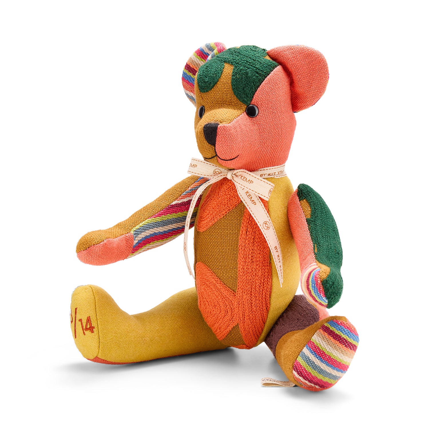 A thoughtfully crafted Large Willow Bear, handmade using repurposed luxury fabric offcuts. Its unique patchwork design features a variety of premium textures and colours, from earthy ochre to bright stripes, creating a charming, high-end collectible with eco-conscious roots.