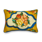 Luxurious Jim Thompson Ondine Mediterranean cushion with a central stylised flower bouquet motif set in a scalloped cartouche. The saturated colour palette provides a vibrant, maximalist feel.