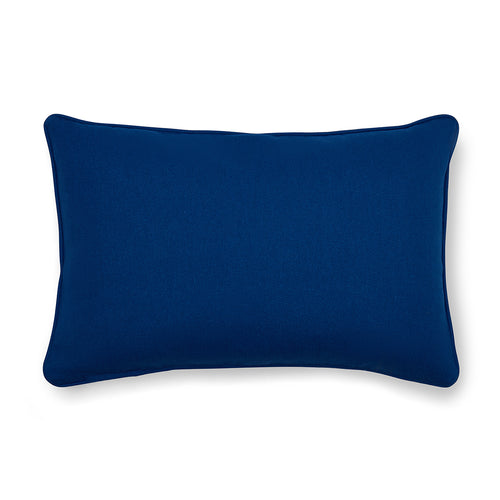 The reverse of the Ondine Mediterranean cushion is a bold, solid royal blue, matching the decorative piping, which perfectly frames the vibrant saffron and floral print.