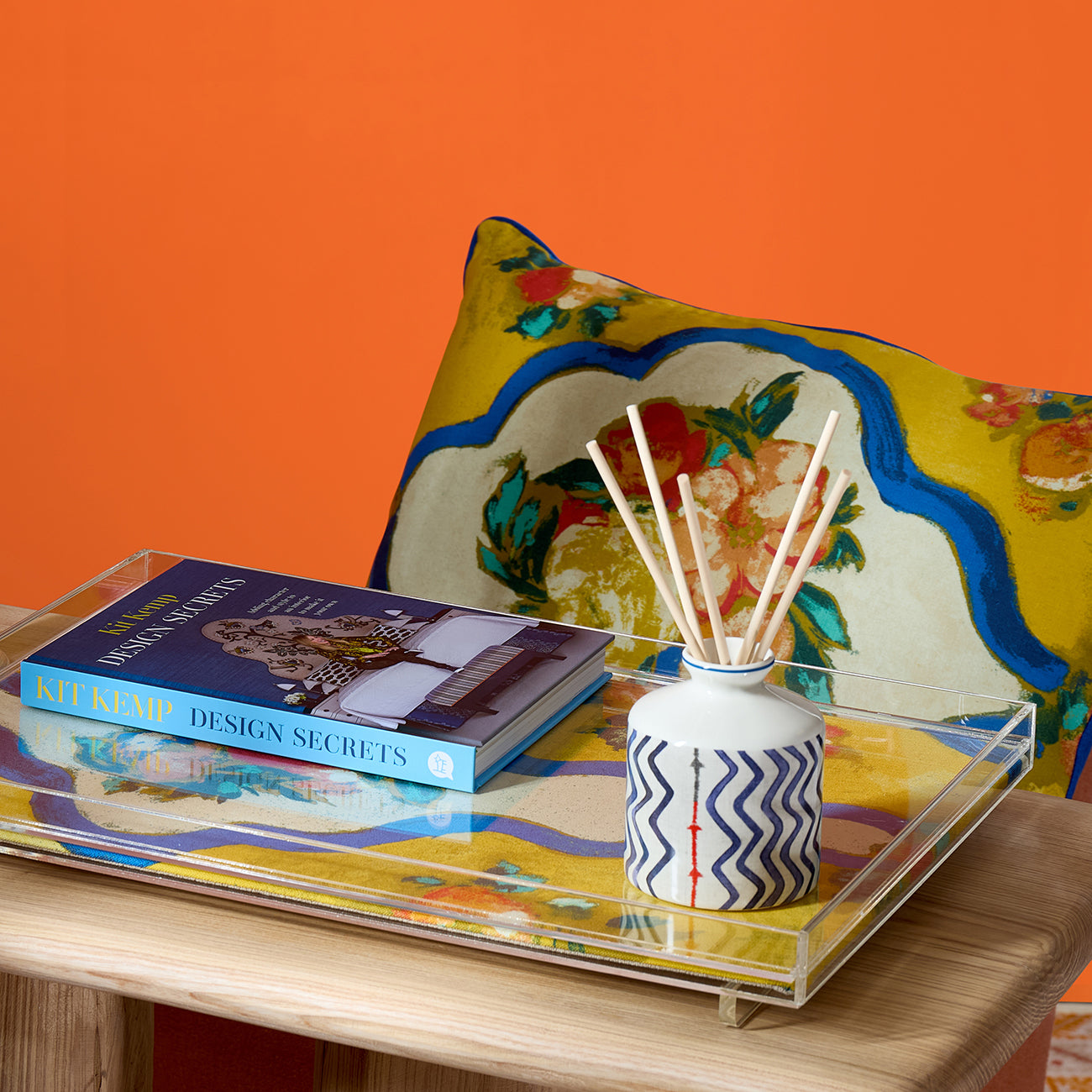 Ondine Mediterranean cushion shows versatility as a statement piece. The striking saffron and blue floral print instantly adds a warm, dramatic mood to any space. Exclusively at Shop Kit Kemp.