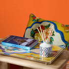 Ondine Mediterranean cushion shows versatility as a statement piece. The striking saffron and blue floral print instantly adds a warm, dramatic mood to any space. Exclusively at Shop Kit Kemp.