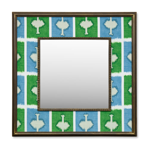 Kit's 'Ozone' checkerboard design with the contrast of the energising green against the vibrant blue, this wonderful decorative mirror ensures a bold pop of colour and joy with its wide fabric-covered border surrounding a square central mirror in a wooden frame. 