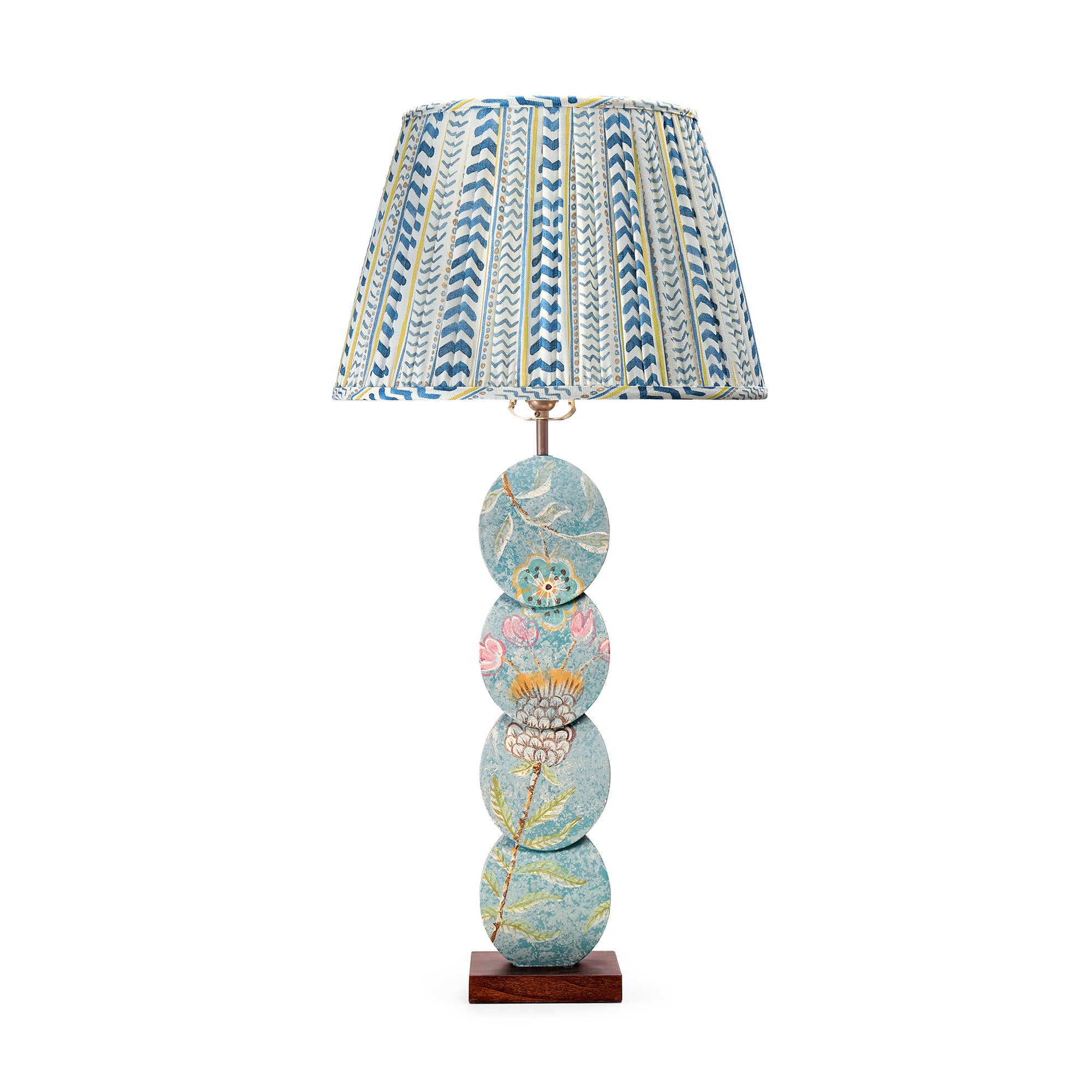 The Papillon Flower Lamp features a handmade timber base with a four-disc design, hand-painted by artist Melissa White. Inspired by the Papillon wallpaper, each lamp is one of a kind, with details varying slightly due to its hand-painted nature. Paired with Wriggle Room gathered fabric lampshade in Blue / Yellow tones.