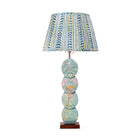 The Papillon Flower Lamp features a handmade timber base with a four-disc design, hand-painted by artist Melissa White. Inspired by the Papillon wallpaper, each lamp is one of a kind, with details varying slightly due to its hand-painted nature. Paired with Wriggle Room gathered fabric lampshade in Blue / Yellow tones.