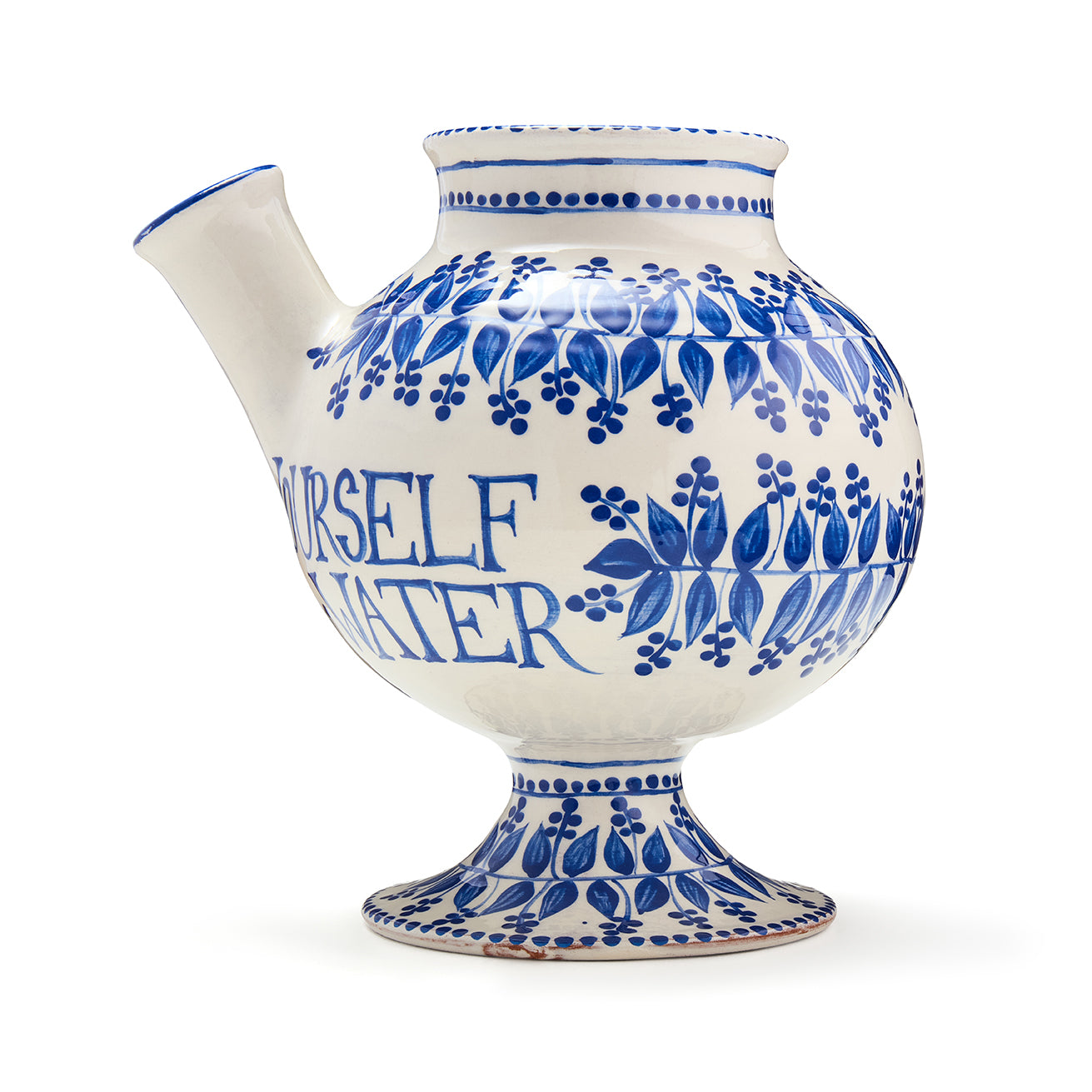 Syrup jug side, with distinctive spout and footed base detail. Rounded body is decorated with text and flora designs. 
