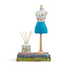 Hand-crafted mini mannequin dressed in a bold, multi-coloured Potato Print folk-art fabric bodice and a contrasting textured blue skirt. A distinctive collector's piece and signature feature in luxury interiors.