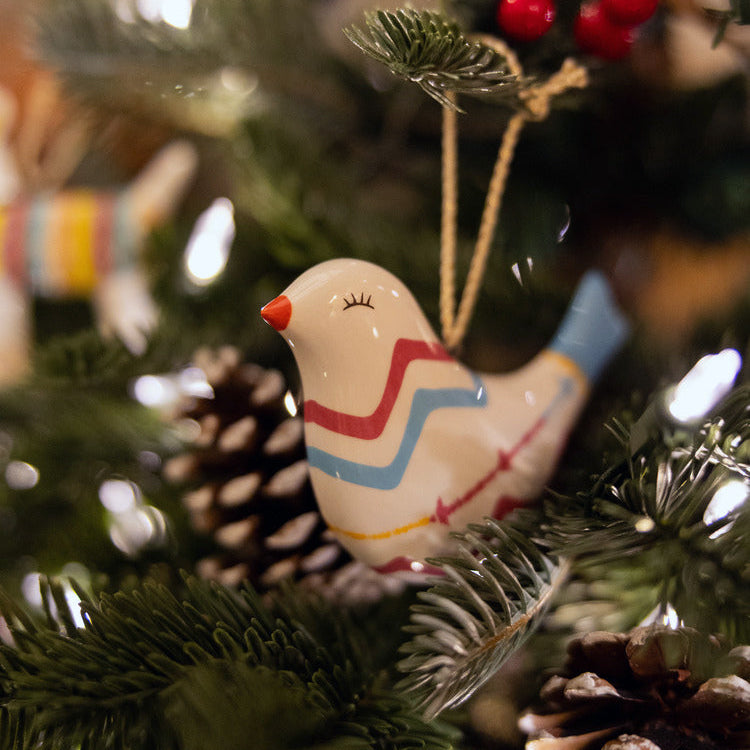 Kit Kemp for Spode fine china Puffed Bird Ornament with a signature Rick Rack pattern in pink and blue. This unique, stylish bird decoration features a vibrant blue tail and a whimsical design. A high-quality collectible piece that makes a delightful and memorable gift.