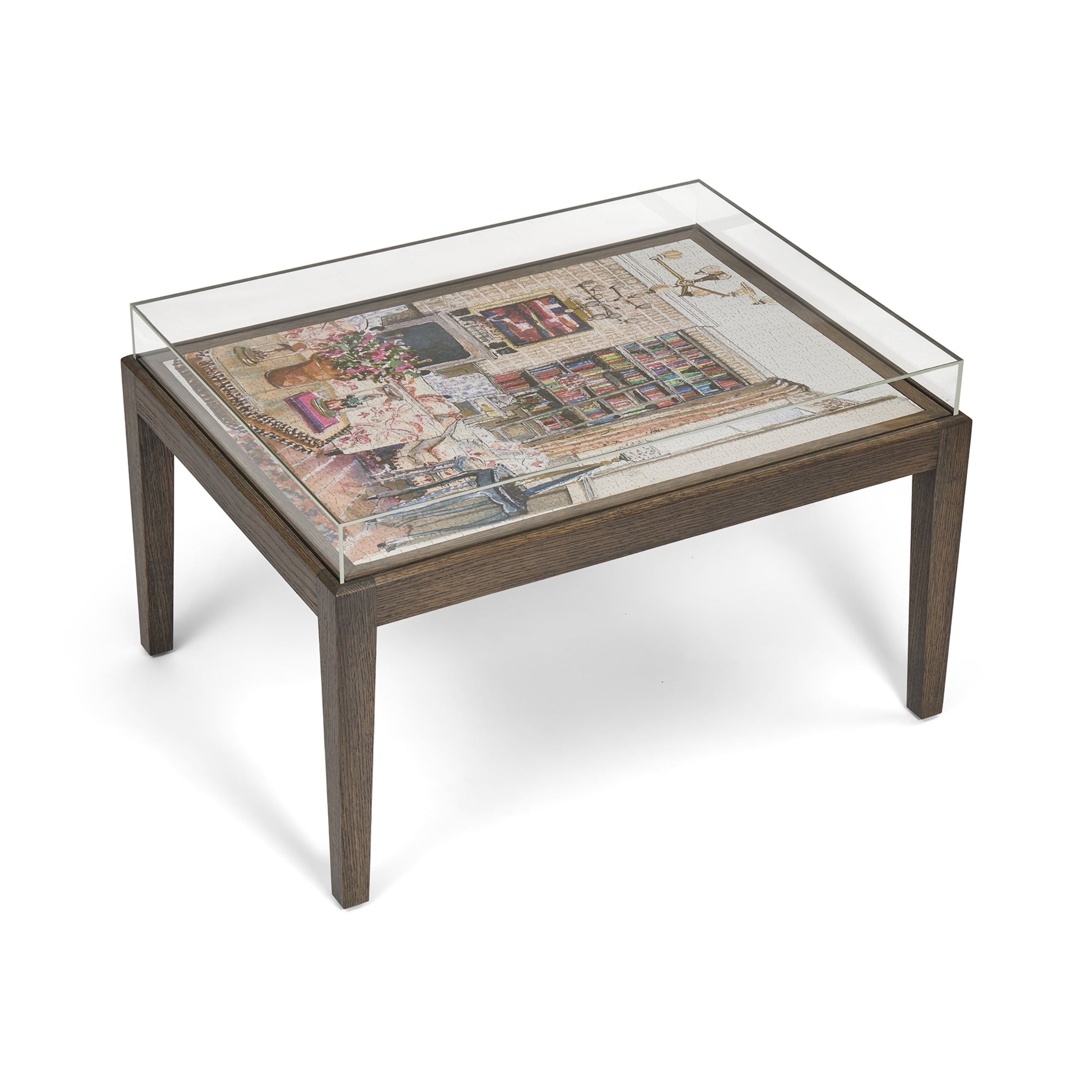 Glass-top coffee table with a decorative inlay on a white background
