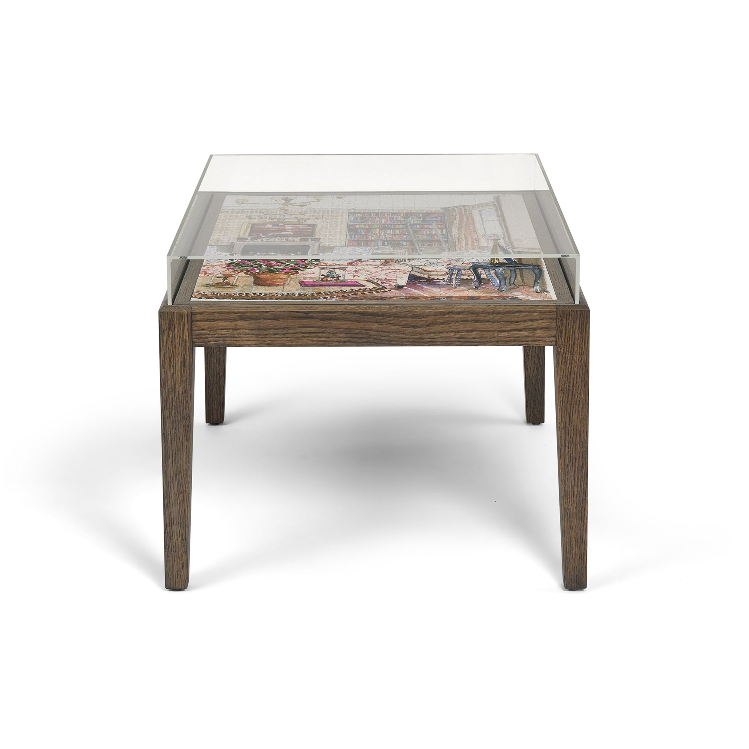 Coffee table with glass top and wooden base on a white background