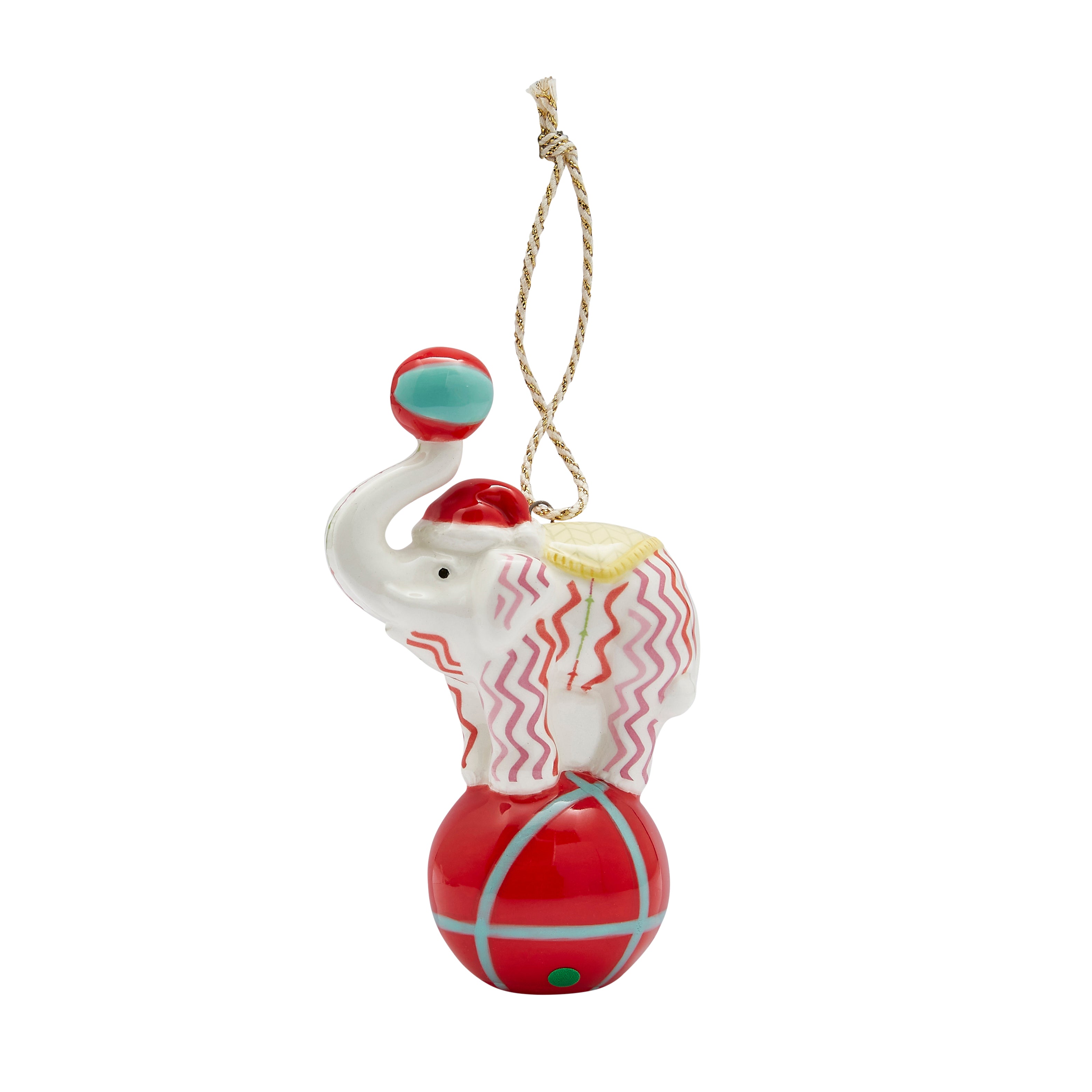 The whimsical Rik Rak Elephant fine china Ornament from the exclusive Kit Kemp for Spode collection. This unique circus-inspired piece features a white elephant balancing on a glossy red ball, holding a small ball in its trunk. The elephant is adorned with the playful pink and red Rick Rack pattern and wears a yellow saddle cloth. A delightful, eye-catching collectible to add joy and designer style to your holiday decor.
