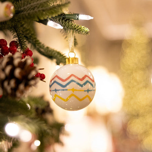 Decorative Christmas ball ornament with colourful Rick Rack zigzag pattern by Kit Kemp for Spode.