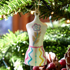 Fine china ornament in Kit Kemp mannequin shape designed for Spode as part of the Christmas decorations collection.