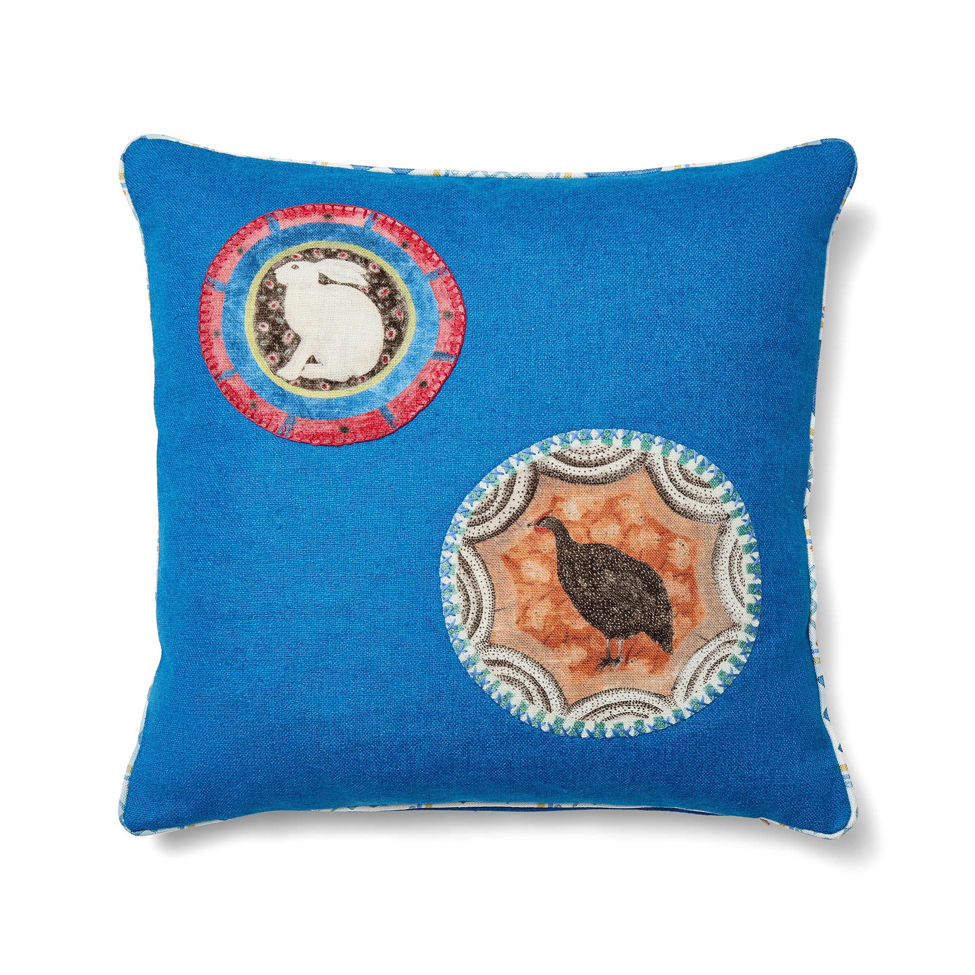 Kit Kemp Design Studio cushion in bold blue textured linen, featuring a unique mix of two Robina's Dinner Party animal appliqués and playful Wriggle Room piping.